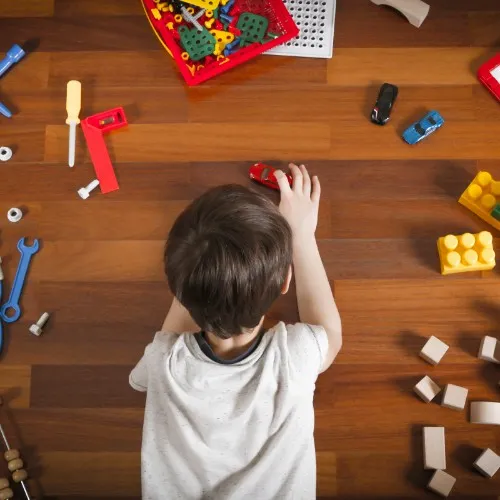 Boy playing with toys | The Flooring Center